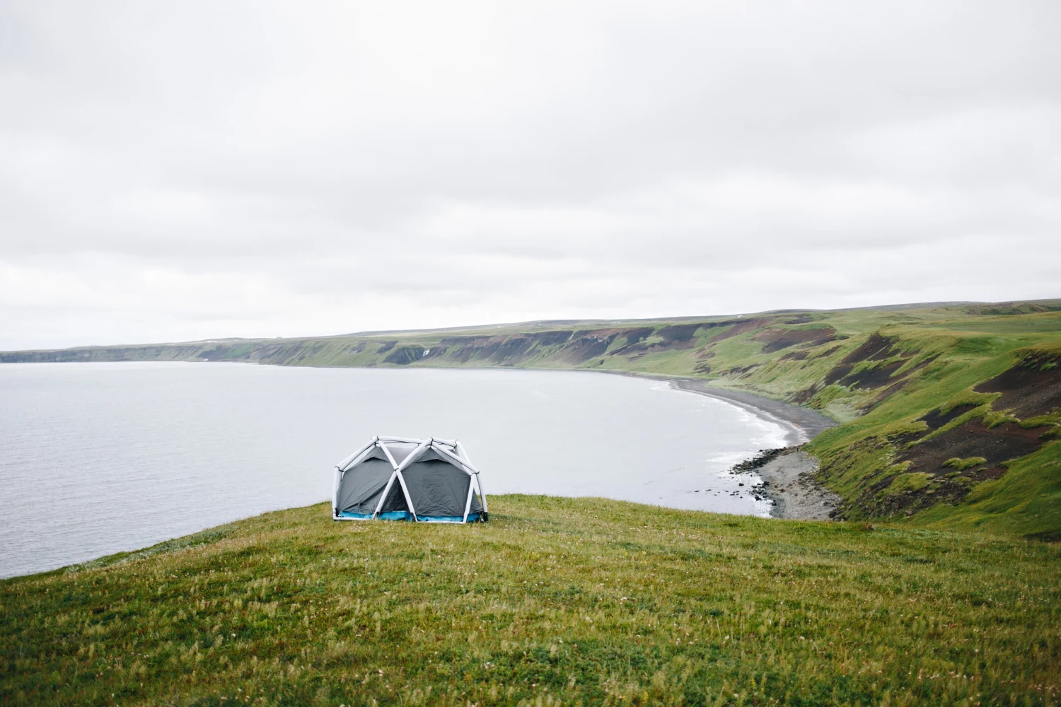 Iceland campsite with North Star campervan parked on grass in the mountains