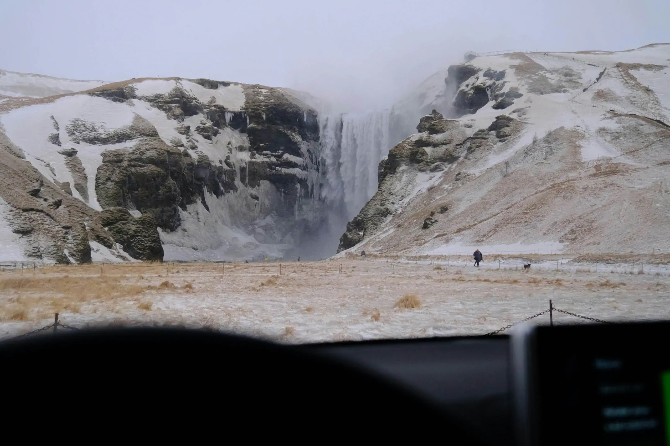 Skogafoss waterfall in Iceland in winter as seen from a campervan stop