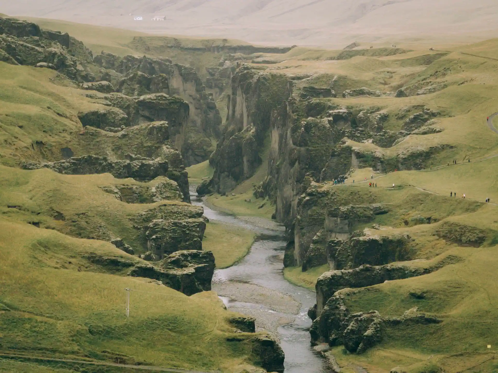 Fjaðrárgljúfur canyon in South Iceland with winding river between moss-covered cliffs along the Ring Road