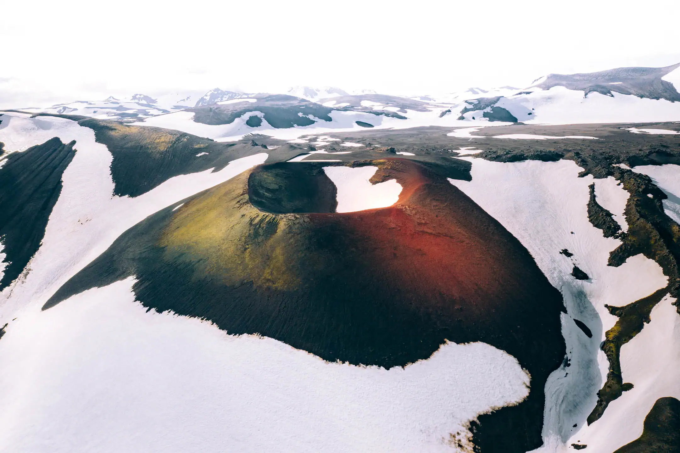 Iceland campervan winter guide showing snowy volcanic mountains and remote Iceland winter landscape